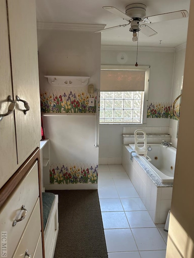 bathroom with tile patterned flooring, ornamental molding, tiled bath, and ceiling fan