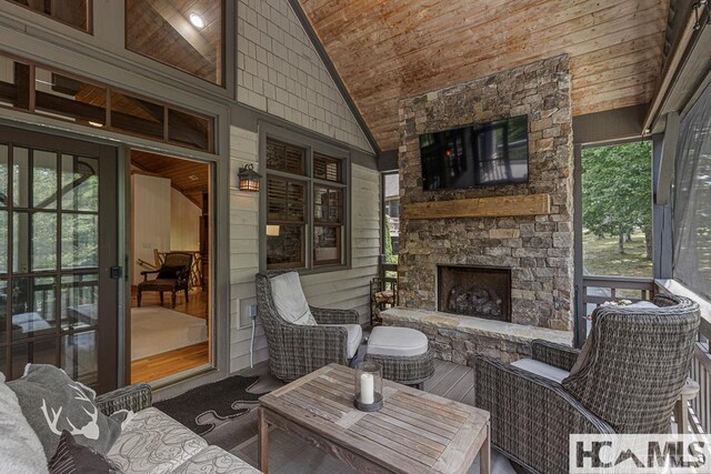 view of patio with an outdoor stone fireplace