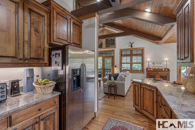 kitchen with stainless steel refrigerator with ice dispenser, wood ceiling, plenty of natural light, light wood-style floors, and open floor plan