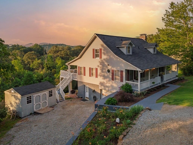 150 Lauren Ln, Franklin, NC 28734 - view of front of property with a porch, stairway, a storage shed, a chimney, and driveway