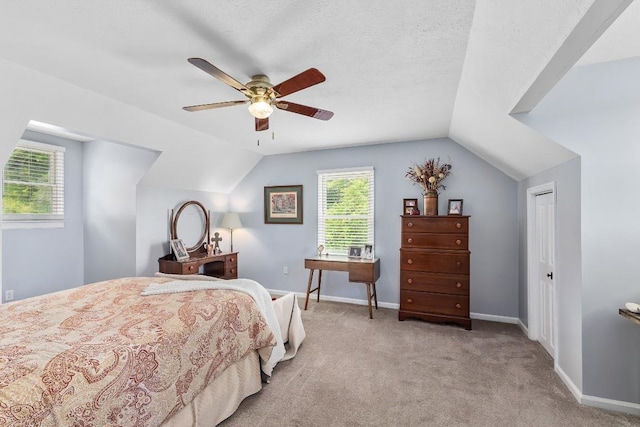 150 Lauren Ln, Franklin, NC 28734 - carpeted bedroom with vaulted ceiling and ceiling fan