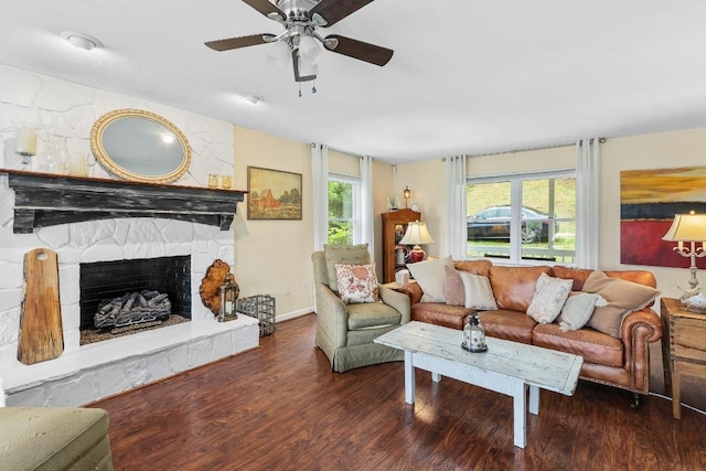150 Lauren Ln, Franklin, NC 28734 - living room with wood finished floors, a ceiling fan, and a stone fireplace