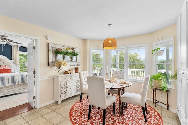 150 Lauren Ln, Franklin, NC 28734 - dining room featuring healthy amount of natural light, wainscoting, and light tile patterned flooring