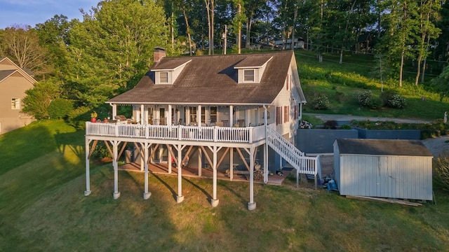150 Lauren Ln, Franklin, NC 28734 - back of house featuring a storage unit, a lawn, a chimney, and a wooden deck