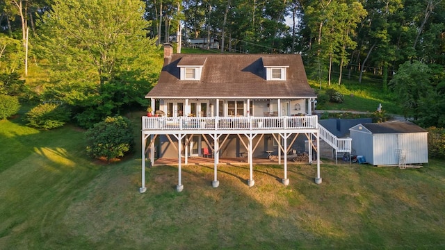 150 Lauren Ln, Franklin, NC 28734 - back of property with a storage shed, a deck, and a lawn