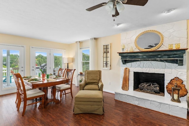 150 Lauren Ln, Franklin, NC 28734 - dining space featuring healthy amount of natural light, a stone fireplace, wood finished floors, and ceiling fan