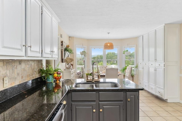 150 Lauren Ln, Franklin, NC 28734 - kitchen with a peninsula, white cabinetry, tasteful backsplash, gray cabinetry, and light tile patterned floors
