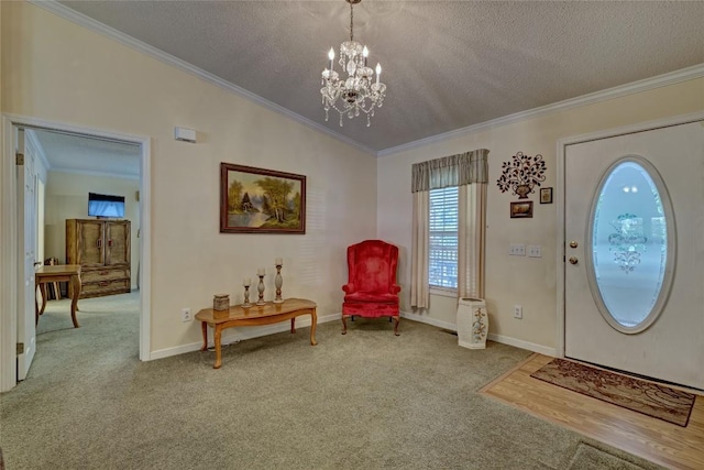 264 Cole Mountain Cir, Highlands, NC 28741 - carpeted entryway with a textured ceiling, a chandelier, and crown molding