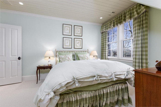 carpeted bedroom featuring visible vents, recessed lighting, crown molding, and baseboards