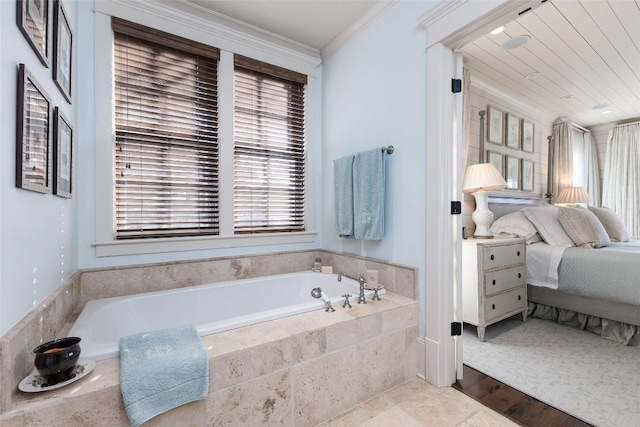 full bath featuring connected bathroom, a bath, and ornamental molding