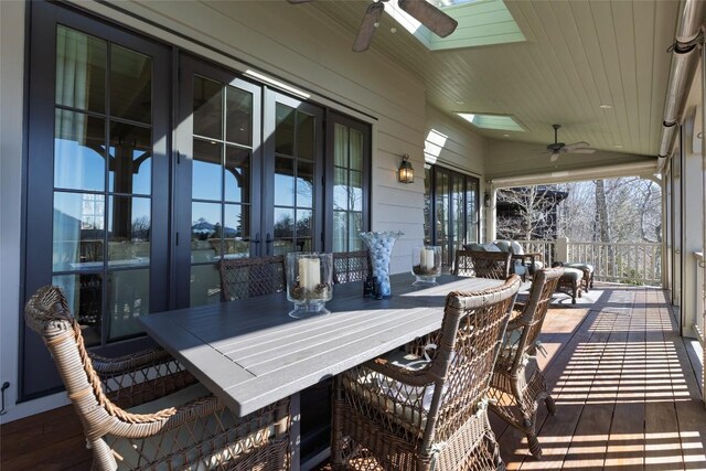 deck with french doors and ceiling fan