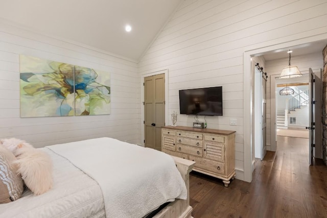 842 N High Mountain Dr, Cashiers, NC 28717 - bedroom with vaulted ceiling, dark wood-type flooring, wood walls, and recessed lighting