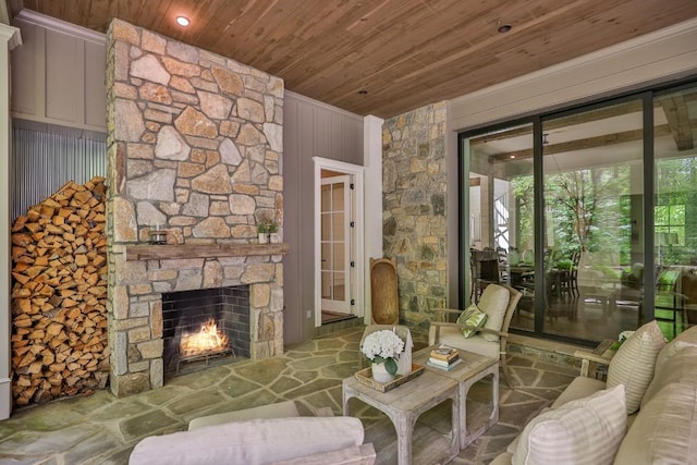 842 N High Mountain Dr, Cashiers, NC 28717 - living area with wooden ceiling, a stone fireplace, and stone flooring