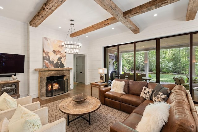 842 N High Mountain Dr, Cashiers, NC 28717 - living area featuring wood finished floors, beam ceiling, recessed lighting, a high end fireplace, and a chandelier