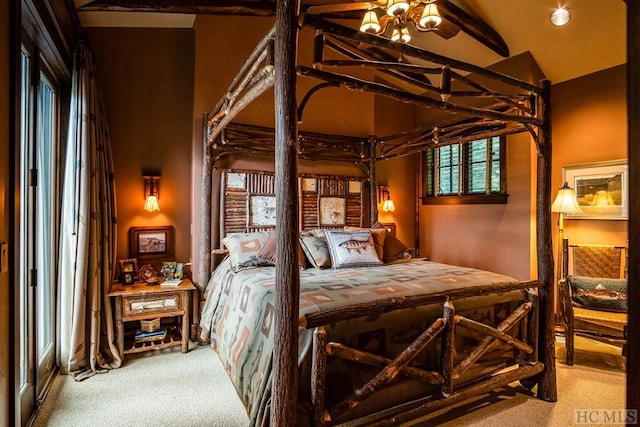 bedroom featuring lofted ceiling with beams, carpet floors, and multiple windows