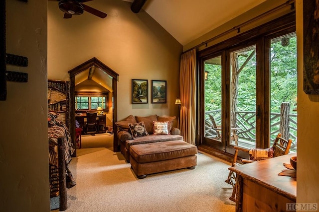 sitting room with ceiling fan, high vaulted ceiling, carpet floors, and beam ceiling