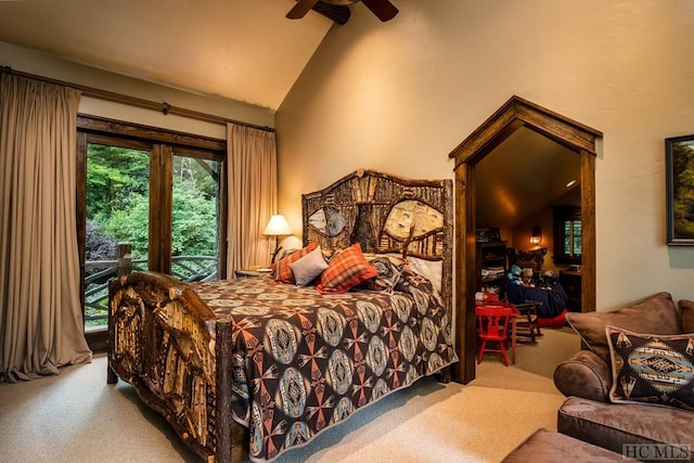 carpeted bedroom with high vaulted ceiling and ceiling fan