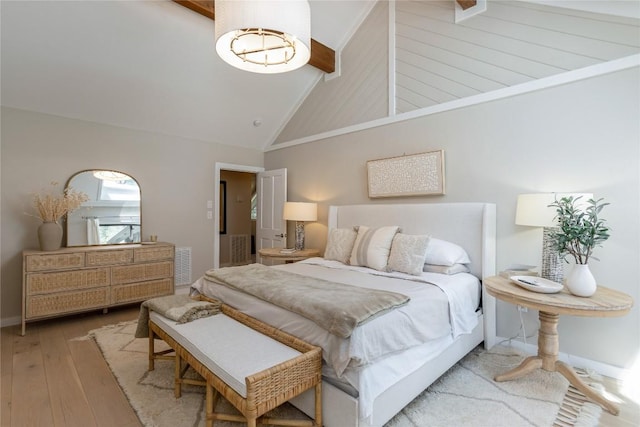 bedroom with baseboards, visible vents, beamed ceiling, high vaulted ceiling, and wood-type flooring