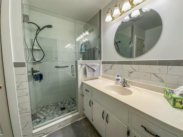 bathroom featuring a shower stall and vanity