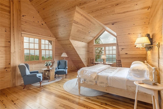 865 Toxaway Dr, Lake Toxaway, NC 28747 - bedroom with wood walls, vaulted ceiling, multiple windows, wood ceiling, and hardwood / wood-style flooring