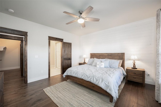 bedroom featuring dark wood-style floors, ceiling fan, and baseboards