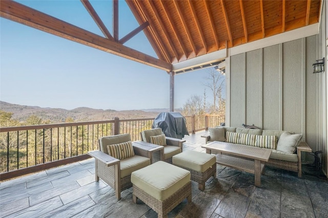 view of patio featuring outdoor lounge area, a mountain view, and area for grilling