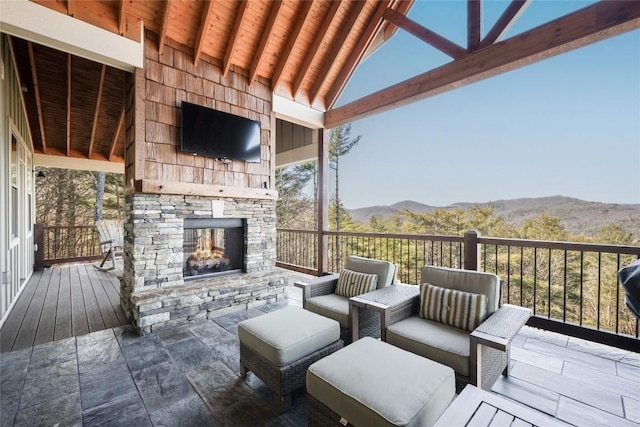 exterior space featuring an outdoor living space with a fireplace