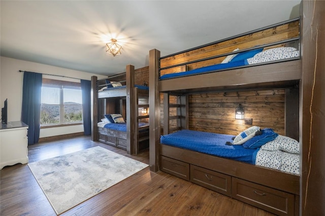 bedroom with dark wood-style floors