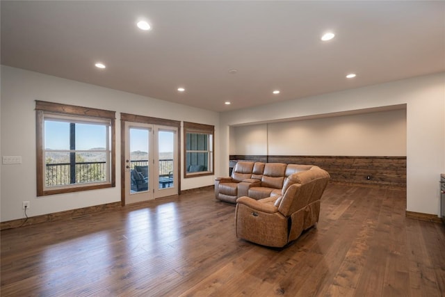 living area with dark wood finished floors and recessed lighting