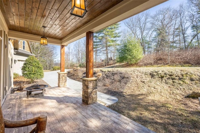 view of patio / terrace with a fire pit