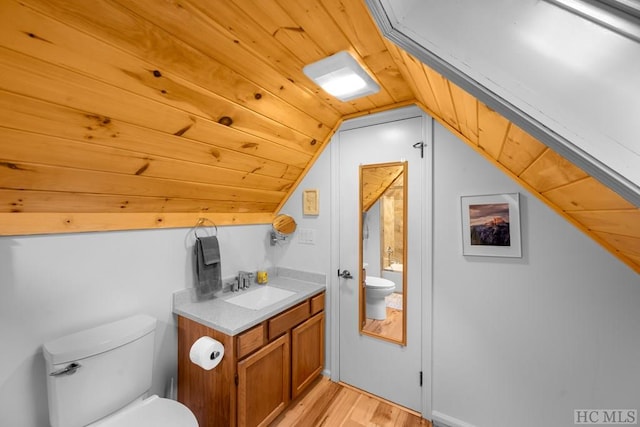 bathroom featuring lofted ceiling, toilet, wooden ceiling, vanity, and hardwood / wood-style flooring