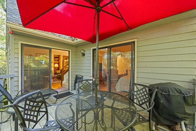 wooden terrace with area for grilling