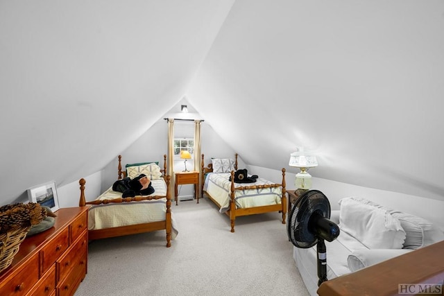 carpeted bedroom with lofted ceiling