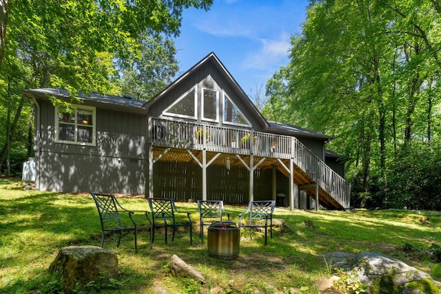 200 Blackberry Trl, Sapphire, NC 28774 - rear view of house with stairway, a deck, and a yard