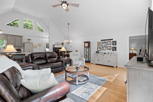 200 Blackberry Trl, Sapphire, NC 28774 - living area featuring a ceiling fan, high vaulted ceiling, a chandelier, and light wood-type flooring