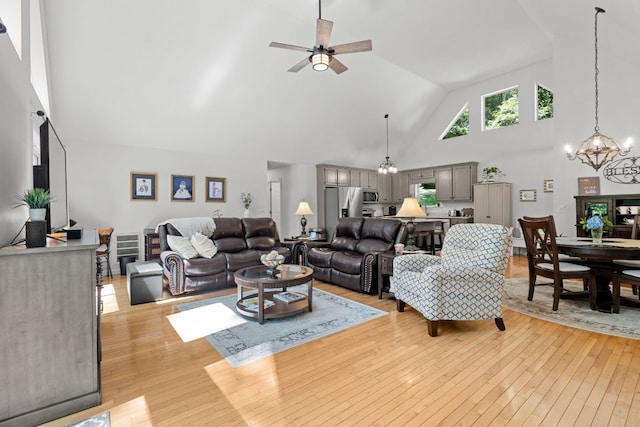 200 Blackberry Trl, Sapphire, NC 28774 - living room featuring high vaulted ceiling, ceiling fan, a chandelier, and light wood-type flooring