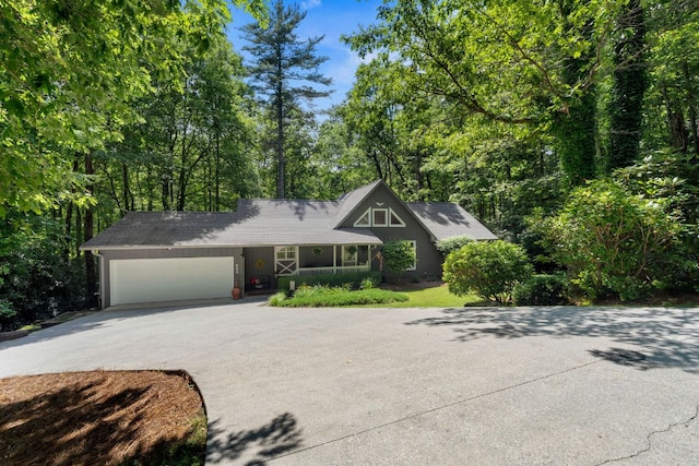 200 Blackberry Trl, Sapphire, NC 28774 - view of front of property featuring driveway, an attached garage, and covered porch