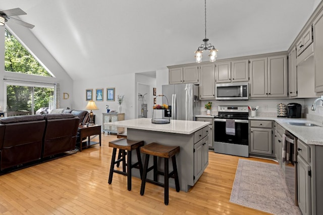 200 Blackberry Trl, Sapphire, NC 28774 - kitchen with appliances with stainless steel finishes, gray cabinetry, high vaulted ceiling, open floor plan, and a kitchen island