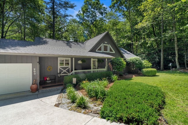 200 Blackberry Trl, Sapphire, NC 28774 - view of front facade featuring covered porch, a garage, roof with shingles, and a front yard