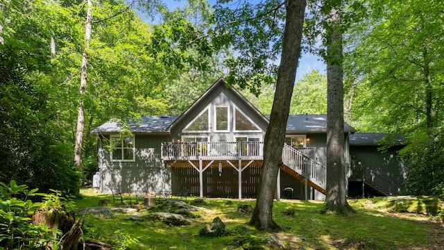 200 Blackberry Trl, Sapphire, NC 28774 - back of property with stairway and a wooden deck