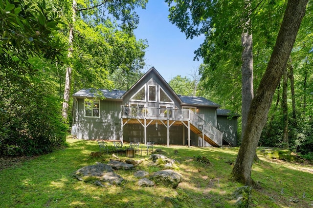 200 Blackberry Trl, Sapphire, NC 28774 - back of property with stairway, a deck, and a yard