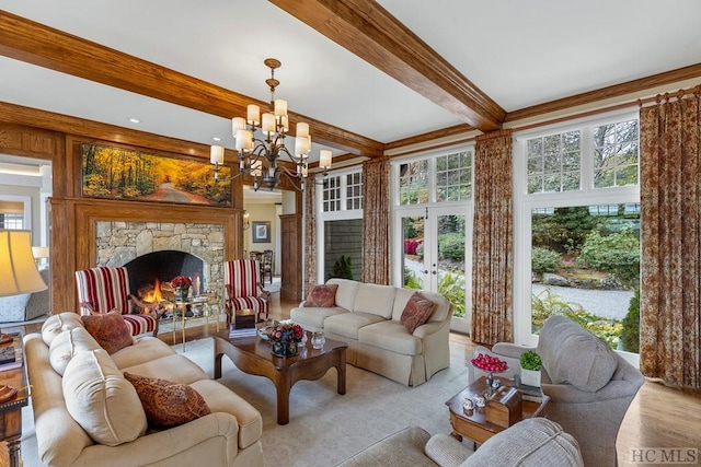 living room with beam ceiling, a fireplace, and a chandelier