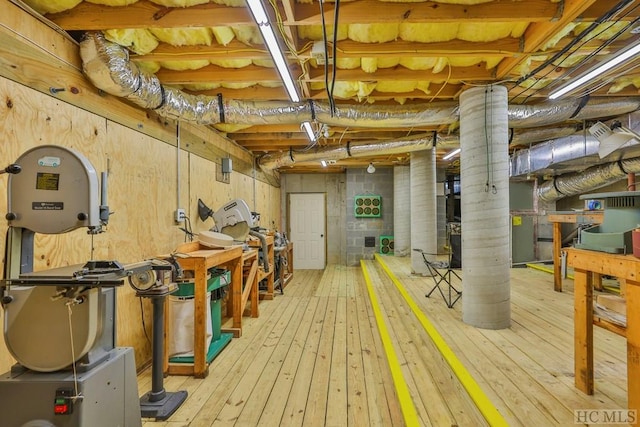 basement with light hardwood / wood-style floors