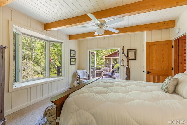 1213 Bull Pen Rd, Cashiers, NC 28717 - carpeted bedroom featuring ceiling fan, access to exterior, wooden walls, and beamed ceiling