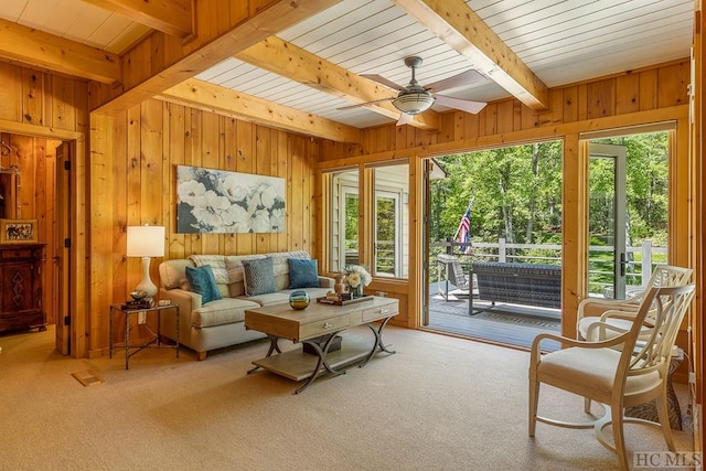 1213 Bull Pen Rd, Cashiers, NC 28717 - carpeted living room featuring plenty of natural light, beamed ceiling, and wood walls