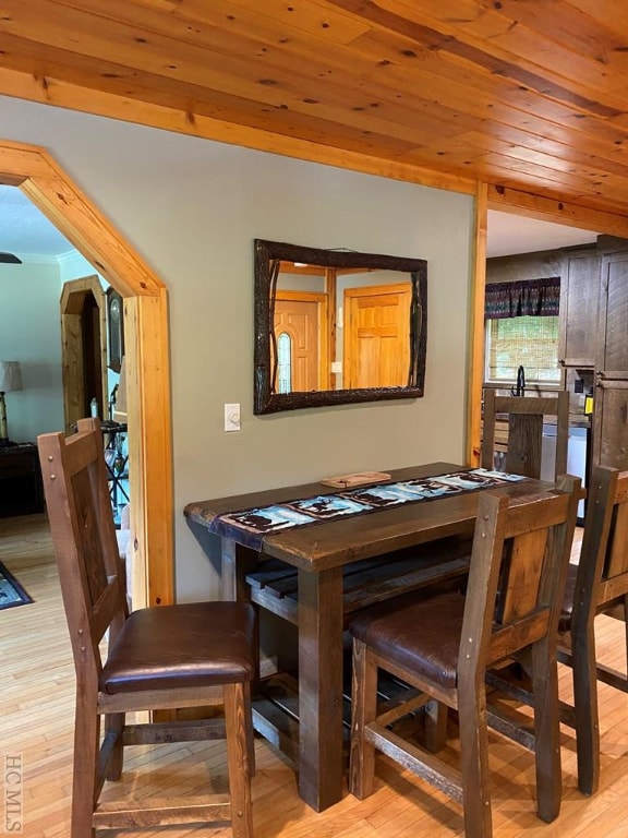 dining area featuring wooden ceiling and light hardwood / wood-style floors