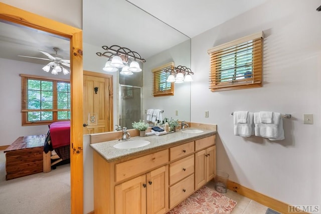 bathroom featuring vanity, tile patterned floors, ceiling fan, and a shower with shower door