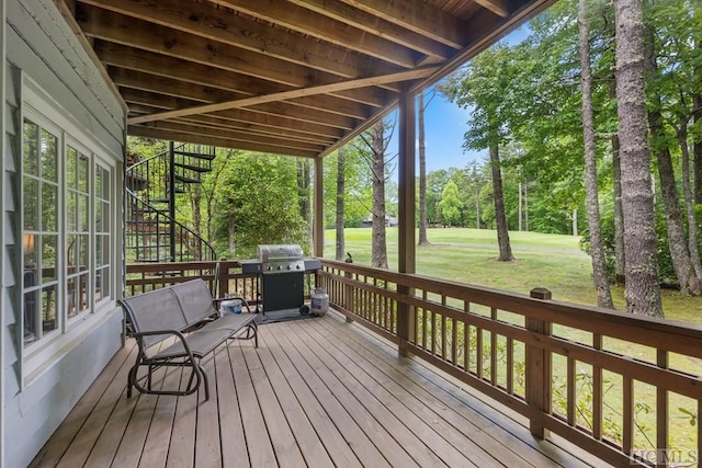 deck with a grill and a yard