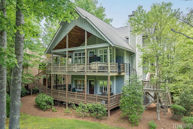 back of house with a wooden deck