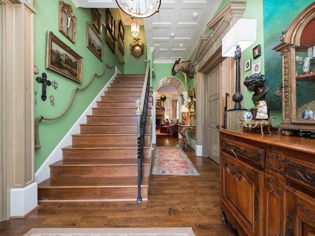 13084 Canada Rd, Tuckasegee, NC 28783 - stairs with wood finished floors, arched walkways, coffered ceiling, and a chandelier